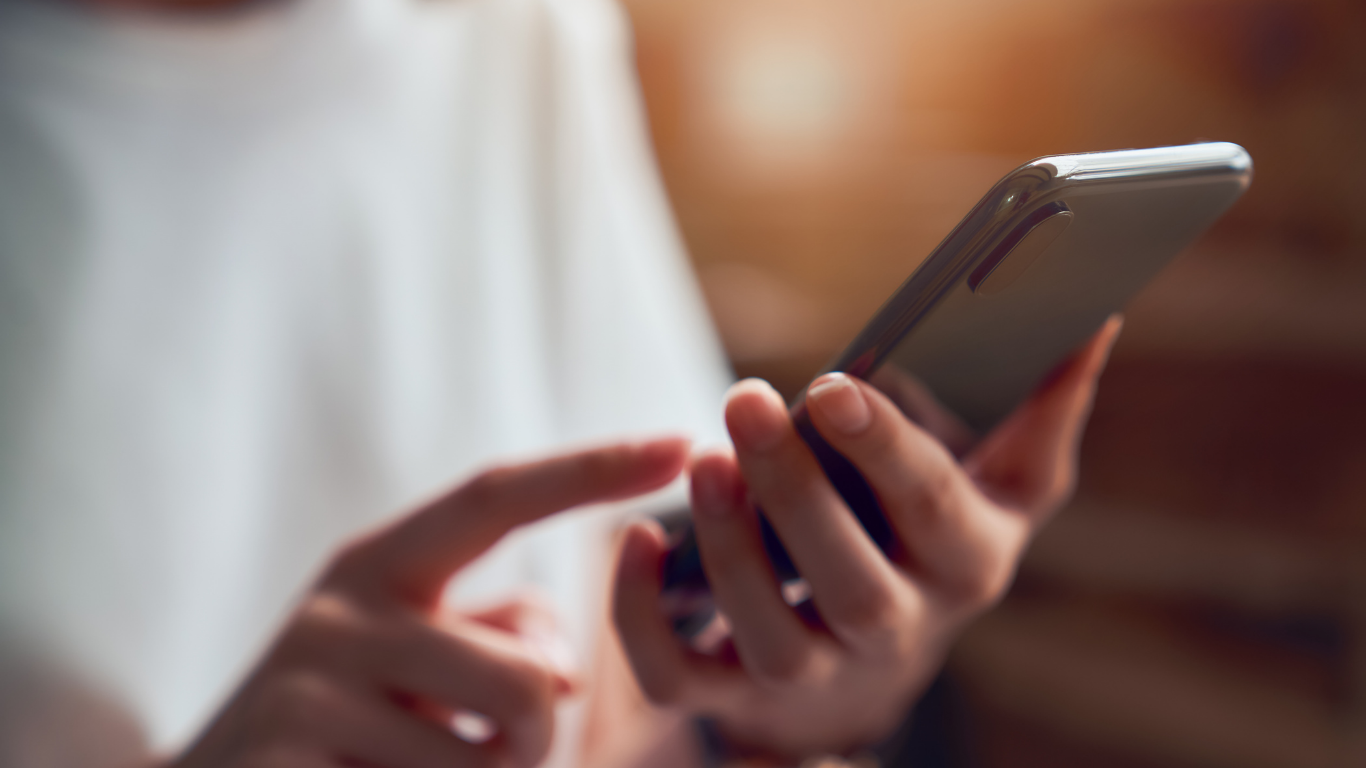 Person using a smartphone to take the survey